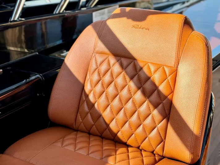 Grey Yacht Photos Pics Luxurious leather seat on 2021 Riva 56 Rivale yacht, featuring elegant diamond stitching.