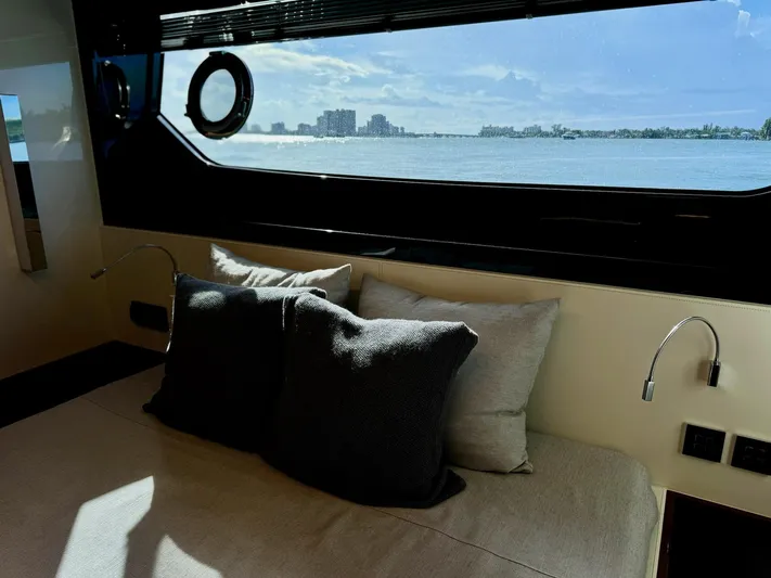 Grey Yacht Photos Pics Interior of 2021 Riva 56 Rivale yacht with ocean view through large window.