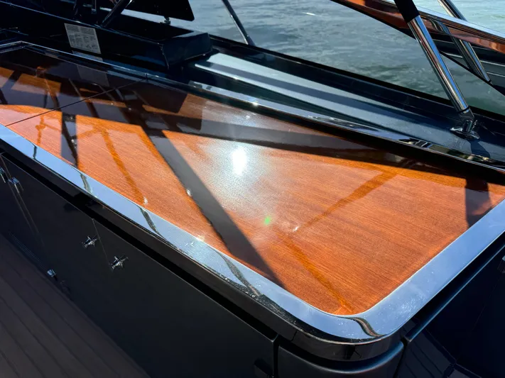 Grey Yacht Photos Pics 2021 Riva 56 RIVALE yacht with polished wood and sleek metal accents.
