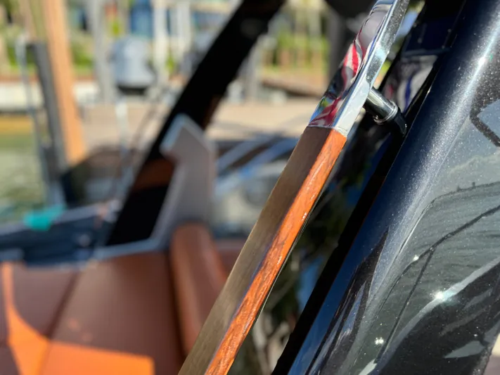 Grey Yacht Photos Pics Close-up of 2021 Riva 56 Rivale yacht interior with wood and leather details.