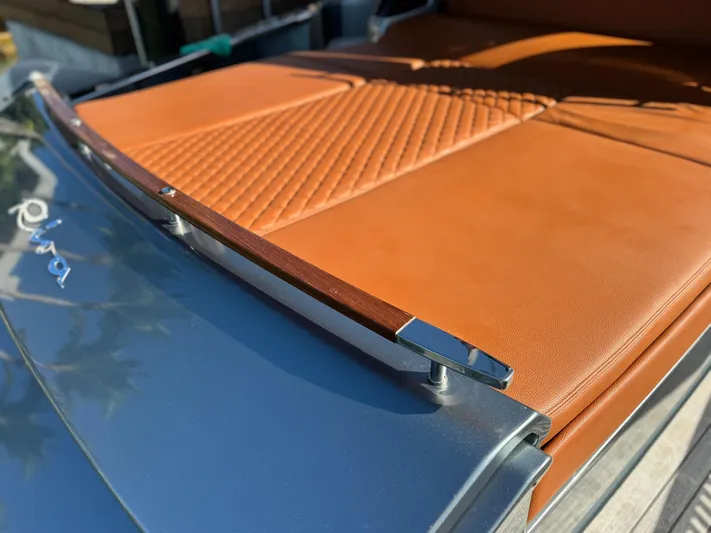 Grey Yacht Photos Pics 2021 Riva 56 Rivale yacht with luxurious tan leather seating and sleek design.