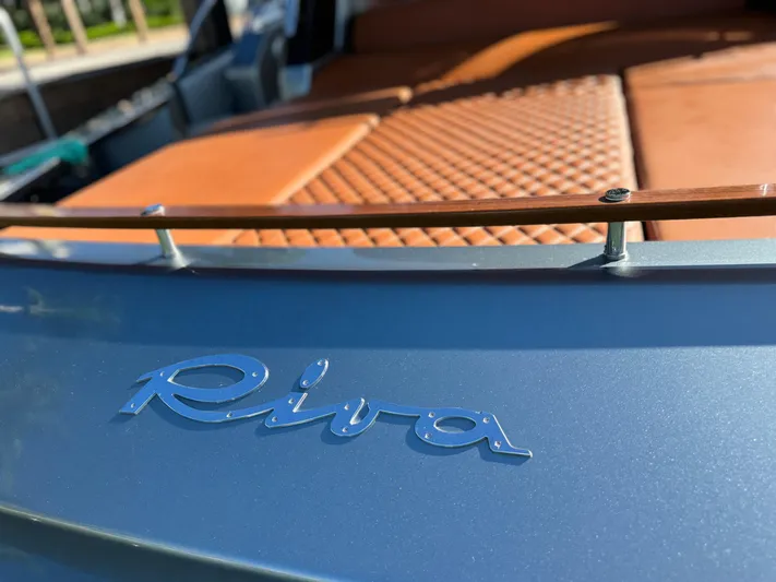 Grey Yacht Photos Pics 2021 Riva 56 Rivale luxury yacht with elegant leather seating and sleek design.