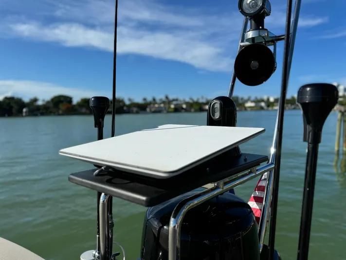 Grey Yacht Photos Pics Antenna setup on 2021 Riva 56 RIVALE yacht against a scenic waterfront backdrop.