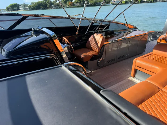 Grey Yacht Photos Pics 2021 Riva 56 Rivale yacht interior with luxurious leather seating and sleek design.