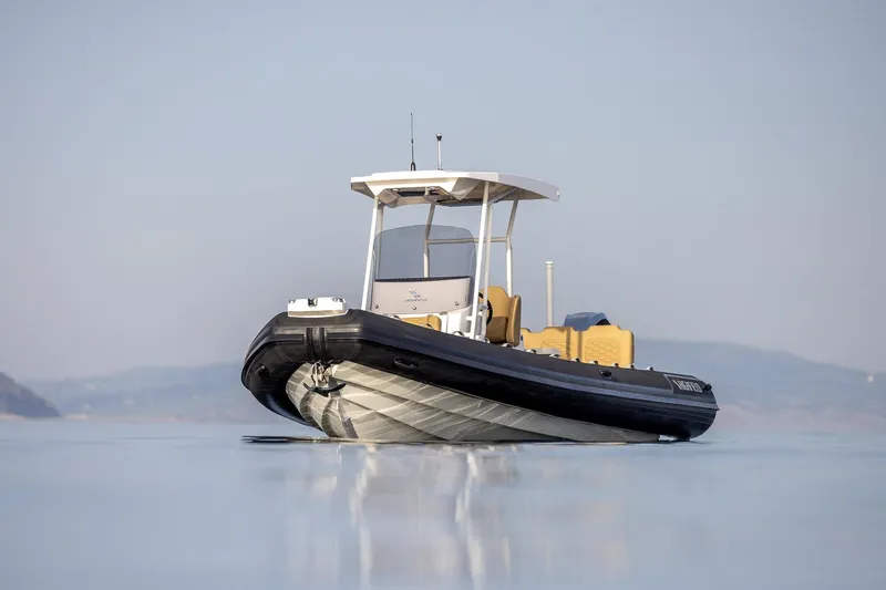  Yacht Photos Pics 2026 Highfield Sport 800 boat on calm water, showcasing sleek design and modern features.