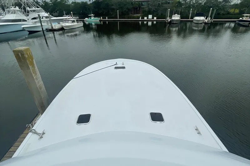  Yacht Photos Pics Bow view of 2004 Custom Carolina 47 Alex Willis yacht docked in marina.