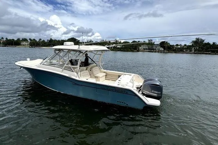  Yacht Photos Pics 2018 Grady-White Freedom 325 boat on calm water with Yamaha engine.