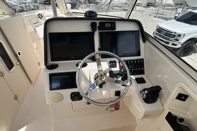  Yacht Photos Pics 2018 Grady-White Freedom 325 helm with dual screens and steering wheel.
