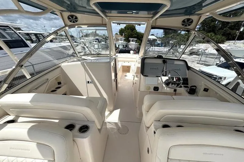  Yacht Photos Pics 2018 Grady-White Freedom 325 boat interior with helm, seating, and dashboard controls.