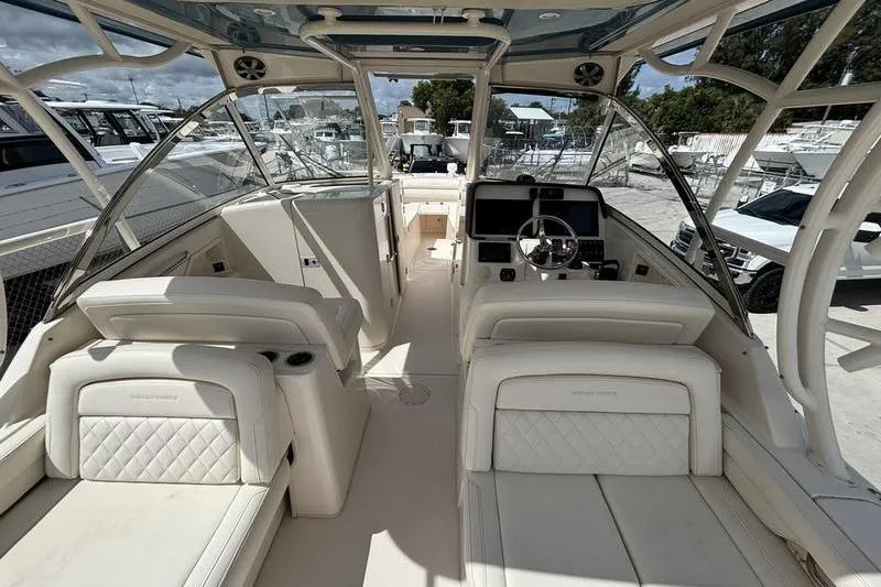  Yacht Photos Pics 2018 Grady-White Freedom 325 boat interior with luxurious seating and modern dashboard.
