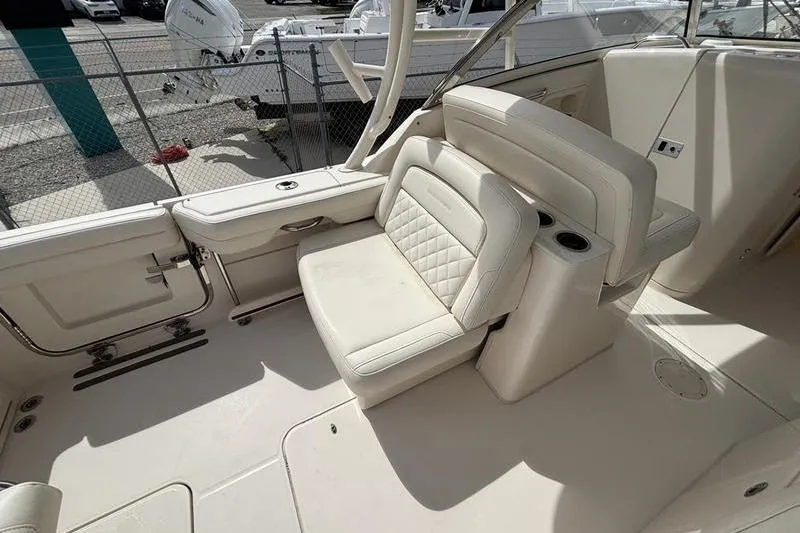  Yacht Photos Pics 2018 Grady-White Freedom 325 boat interior with white seating and cup holders.