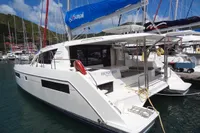2020 Leopard 40 catamaran docked in marina, featuring Sunsail branding and spacious deck.