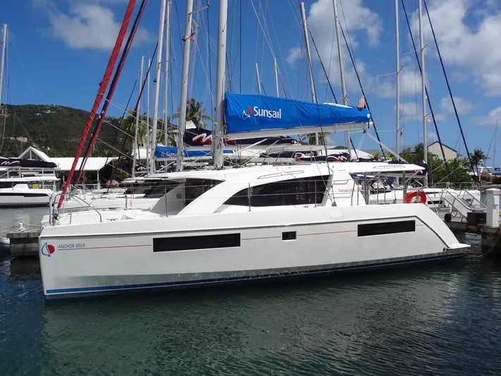 Anchor Beer Yacht Photos Pics 2020 Leopard 40 catamaran docked, featuring a blue Sunsail sail, under a clear sky.