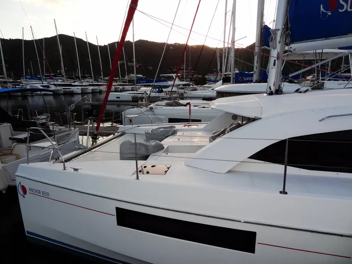 Anchor Beer Yacht Photos Pics 2020 Leopard 40 catamaran docked in a marina at sunset.