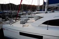 2020 Leopard 40 catamaran docked in a marina at sunset.