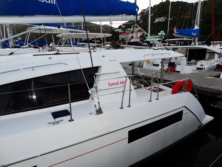 Anchor Beer Yacht Photos Pics 2020 Leopard 40 catamaran docked at marina with blue sail covers.