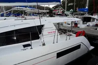 2020 Leopard 40 catamaran docked at marina with blue sail covers.