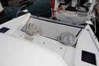 Catamaran deck with netting and bean bags, Leopard 40, 2020 model, docked at marina.
