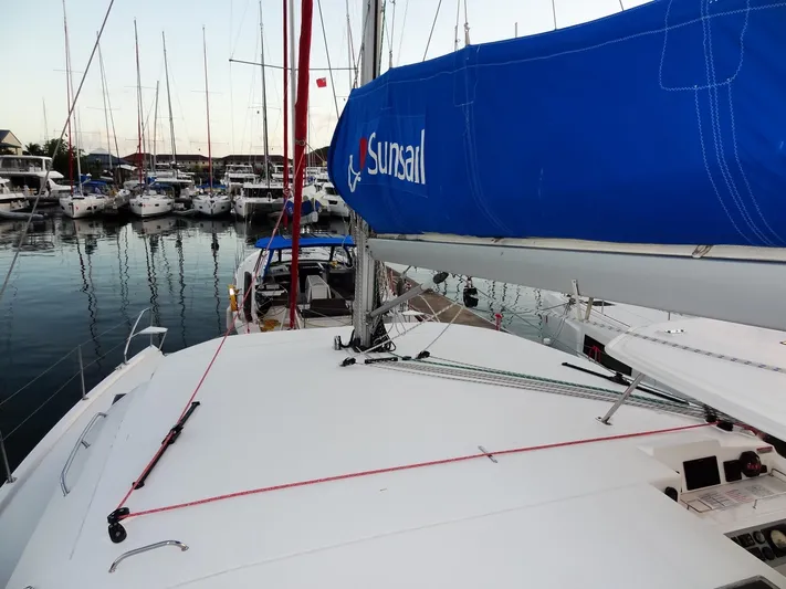 Anchor Beer Yacht Photos Pics Leopard 40 catamaran docked in marina, featuring blue sail cover, surrounded by other boats.