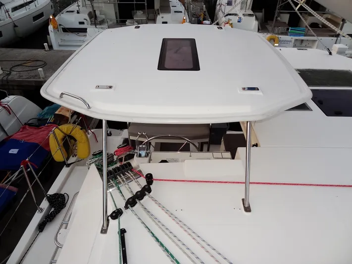 Anchor Beer Yacht Photos Pics Leopard 40 catamaran deck view, showcasing ropes and hatch, docked at marina.