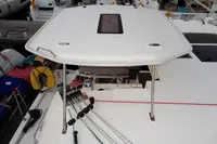 Leopard 40 catamaran deck view, showcasing ropes and hatch, docked at marina.