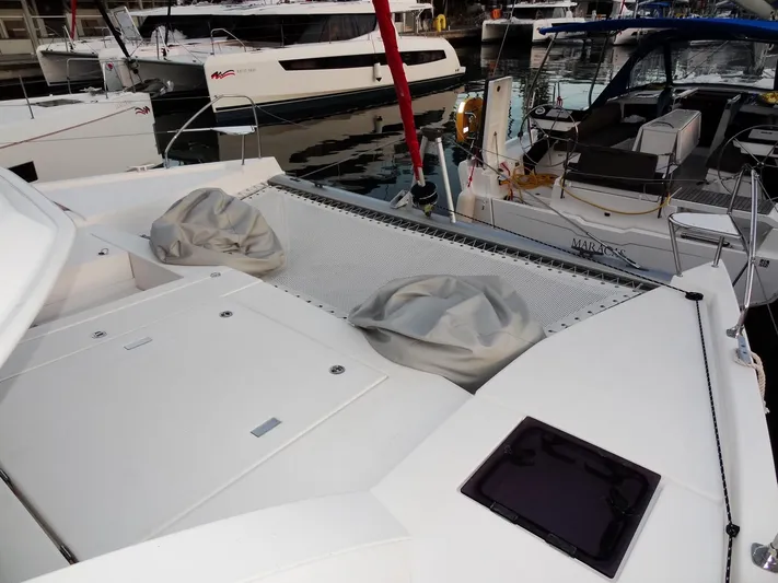 Anchor Beer Yacht Photos Pics Leopard 40 catamaran deck with netting and covered seating, docked at marina, 2020 model.