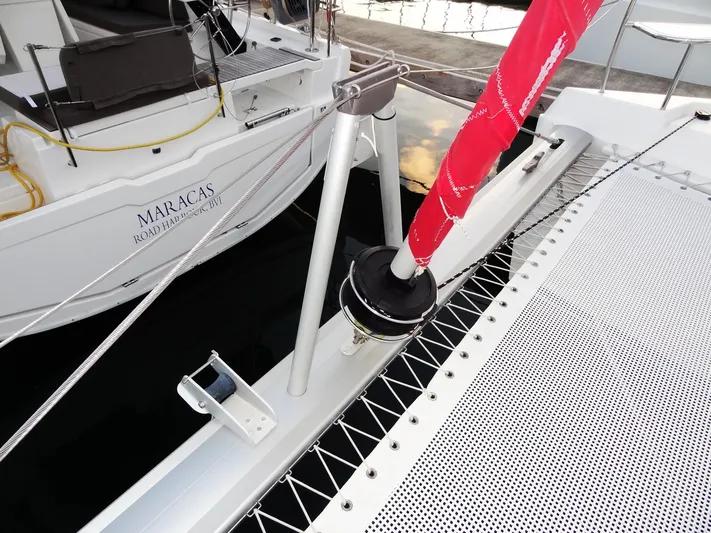 Anchor Beer Yacht Photos Pics Leopard 40 catamaran deck with red sail, 2020 model, docked at marina.