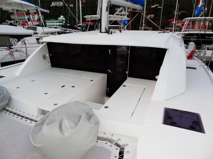 Anchor Beer Yacht Photos Pics 2020 Leopard 40 catamaran deck with seating and storage, docked at marina.