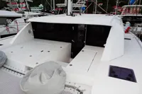 2020 Leopard 40 catamaran deck with seating and storage, docked at marina.