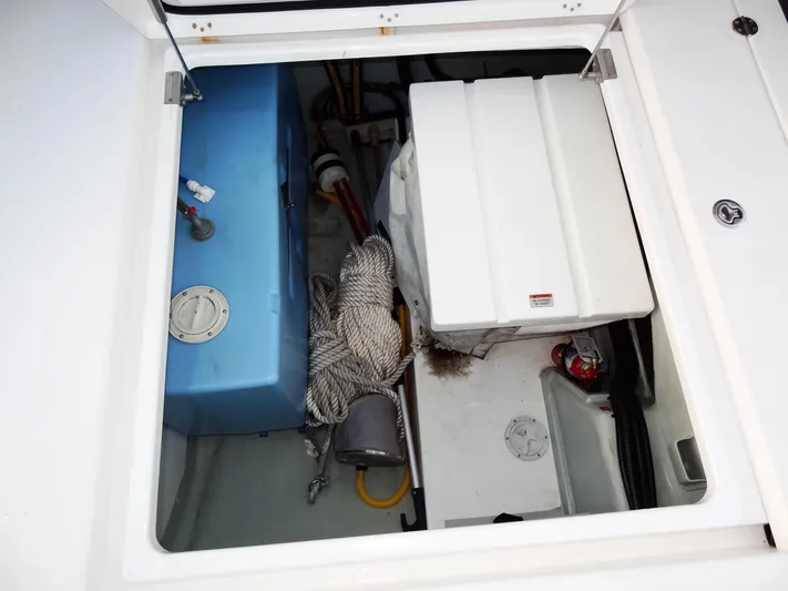 Anchor Beer Yacht Photos Pics Storage compartment of a 2020 Leopard 40 boat with equipment and supplies.