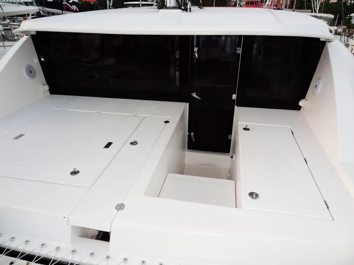 Anchor Beer Yacht Photos Pics 2020 Leopard 40 catamaran deck with sleek white design and storage compartments.
