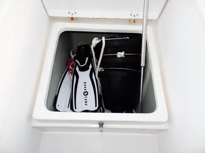 Anchor Beer Yacht Photos Pics Storage compartment on a 2020 Leopard 40 with diving fins, rope, and buckets.