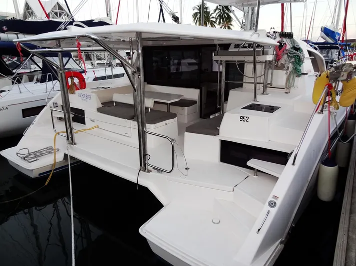 Anchor Beer Yacht Photos Pics 2020 Leopard 40 catamaran docked, featuring spacious deck and seating area.