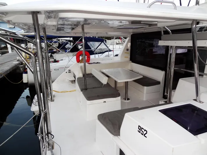 Anchor Beer Yacht Photos Pics Leopard 40 catamaran, 2020 model, featuring spacious outdoor seating and dining area at the dock.