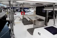 Leopard 40 catamaran, 2020 model, featuring spacious outdoor seating and dining area at the dock.
