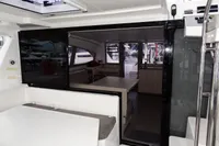 Interior view of a 2020 Leopard 40 catamaran, showcasing modern seating and dining area.