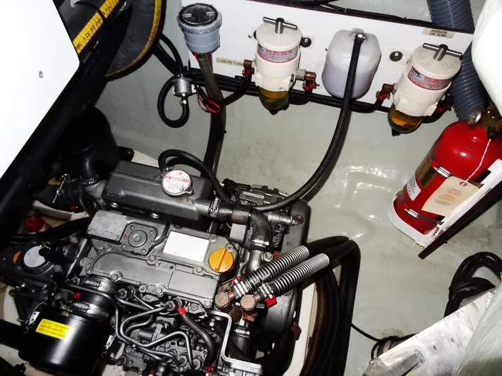 Anchor Beer Yacht Photos Pics Engine room of 2020 Leopard 40 catamaran with visible engine, filters, and fire extinguisher.