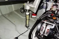 Engine room of a 2020 Leopard 40 catamaran, featuring mechanical components and wiring.