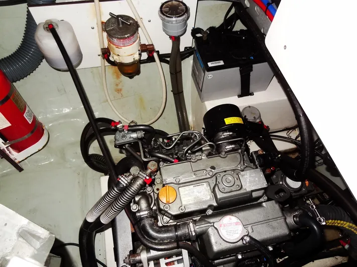 Anchor Beer Yacht Photos Pics Engine compartment of a 2020 Leopard 40 catamaran, featuring mechanical components and a fire extinguisher.
