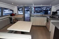 Interior of 2020 Leopard 40 catamaran with modern kitchen and dining area.