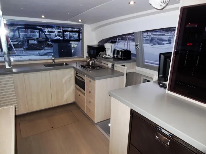 Anchor Beer Yacht Photos Pics Modern kitchen interior of 2020 Leopard 40 yacht with appliances and ample counter space.
