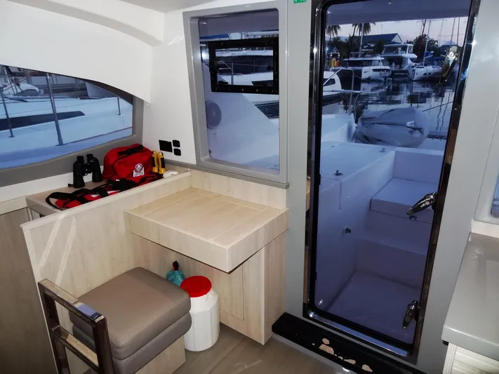 Anchor Beer Yacht Photos Pics Interior of 2020 Leopard 40 catamaran with desk, chair, and marina view.