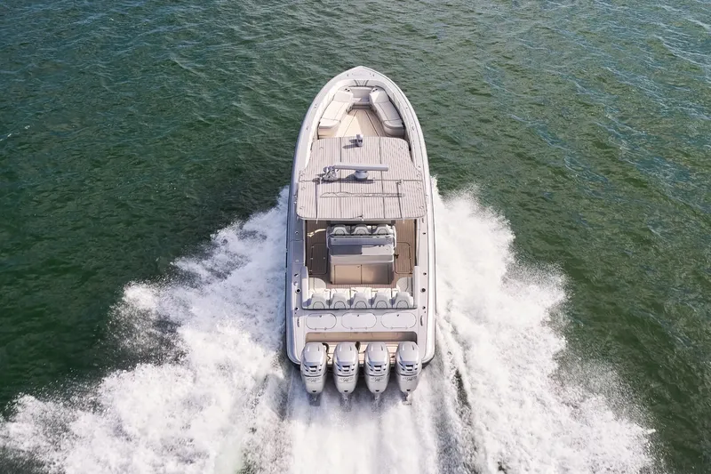  Yacht Photos Pics Aerial view of Midnight Express 43 Open boat speeding on water.