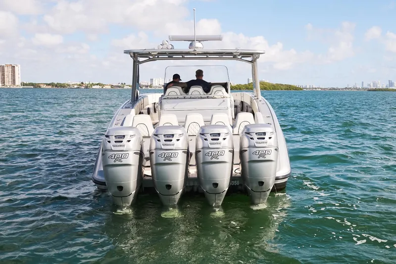  Yacht Photos Pics Midnight Express 43 Open boat with four powerful outboard engines on the water.