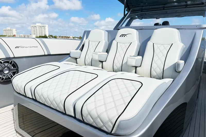  Yacht Photos Pics Luxurious seating on a Midnight Express 43 Open boat with quilted white upholstery.