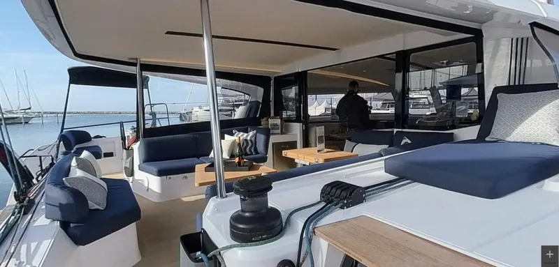 Good Wibe Yacht Photos Pics 2024 Nautitech 48 Open yacht interior with modern seating and ocean view.