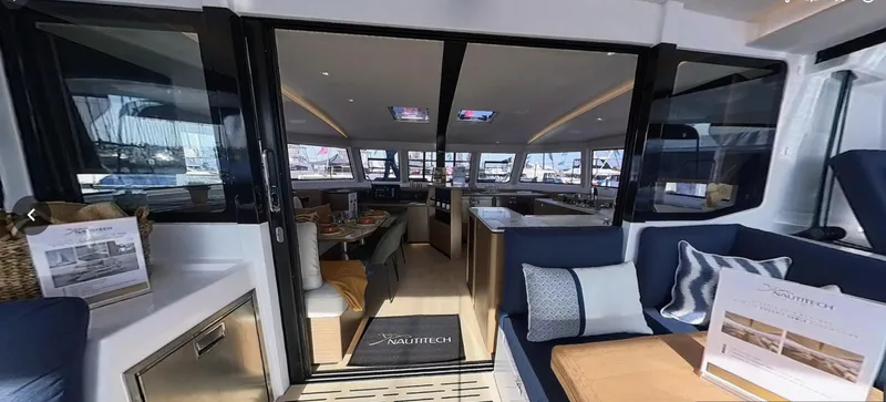Good Wibe Yacht Photos Pics 2024 Nautitech 48 Open yacht interior with modern seating and panoramic windows.