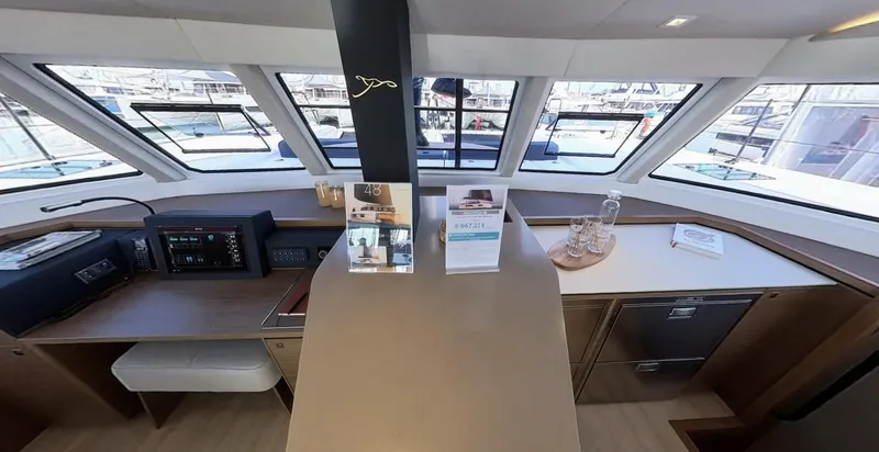 Good Wibe Yacht Photos Pics Interior of 2024 Nautitech 48 Open yacht with modern navigation and kitchen area.