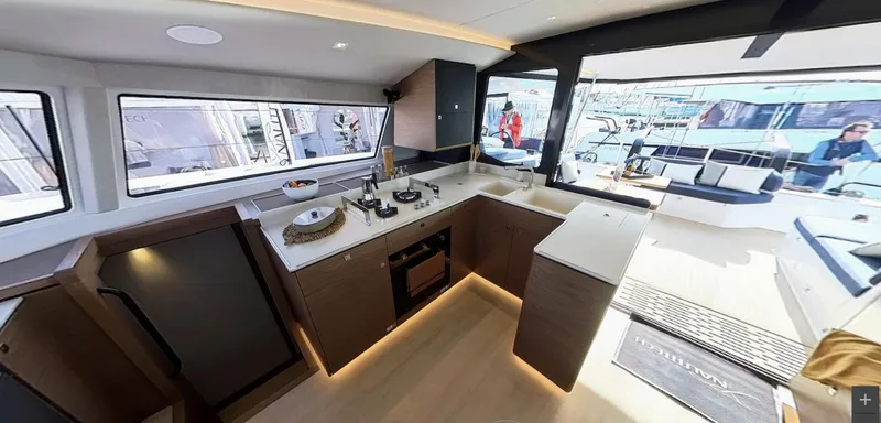 Good Wibe Yacht Photos Pics Modern kitchen interior of 2024 Nautitech 48 Open catamaran with sleek design and ample natural light.