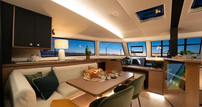Good Wibe Yacht Photos Pics Luxurious interior of 2024 Nautitech 48 Open catamaran with modern furnishings and panoramic windows.